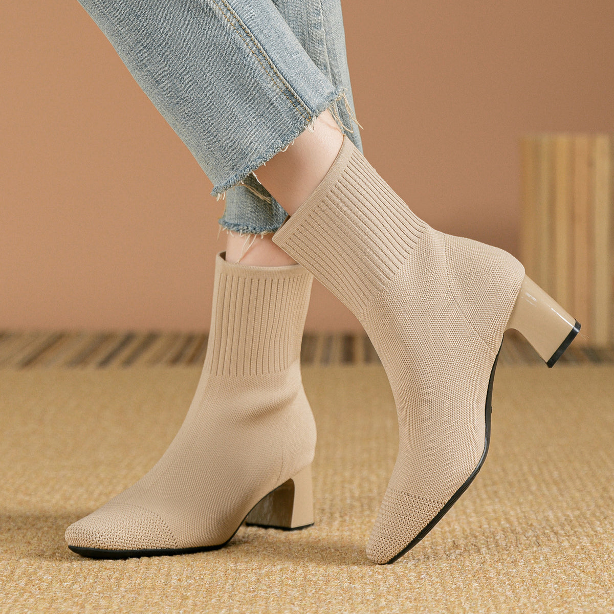 Knitted sock boots with chunky heel and stretchy mid-calf fit
