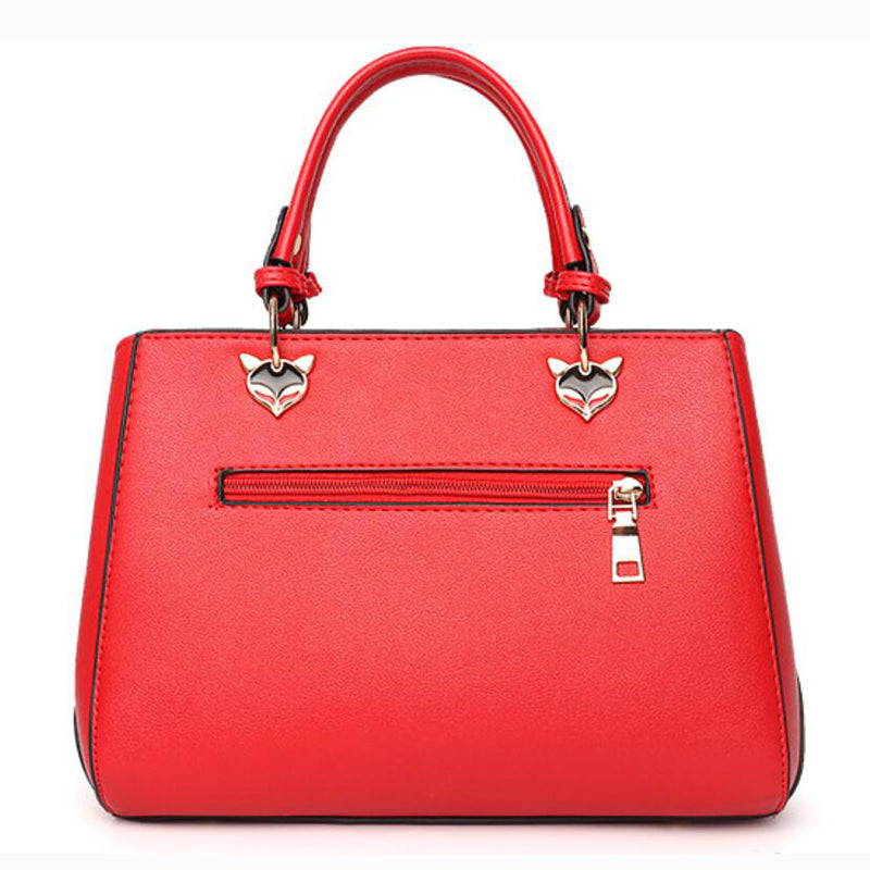 Colour-block handbag with pompom charm