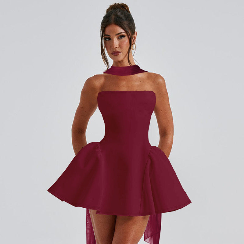 Woman in a strapless mini dress with neck scarf