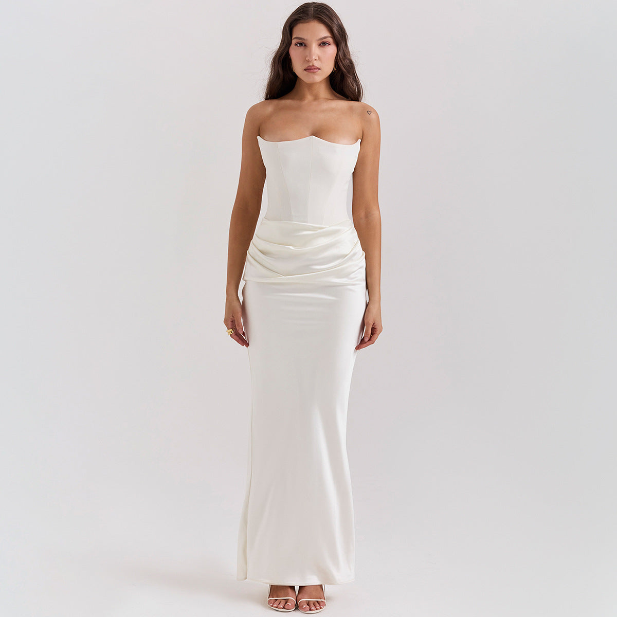 Woman in a strapless satin maxi dress