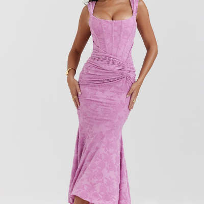 Woman in an off-shoulder ruched maxi dress