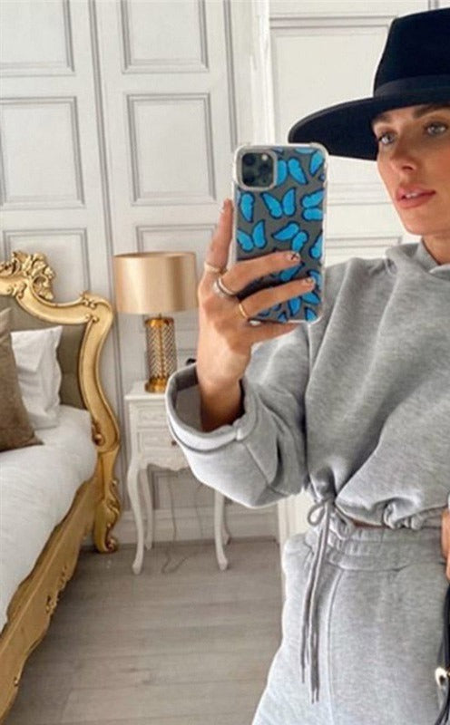Woman in cropped hoodie and joggers