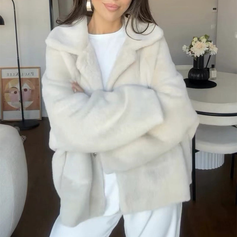 Woman in an off-white teddy jacket