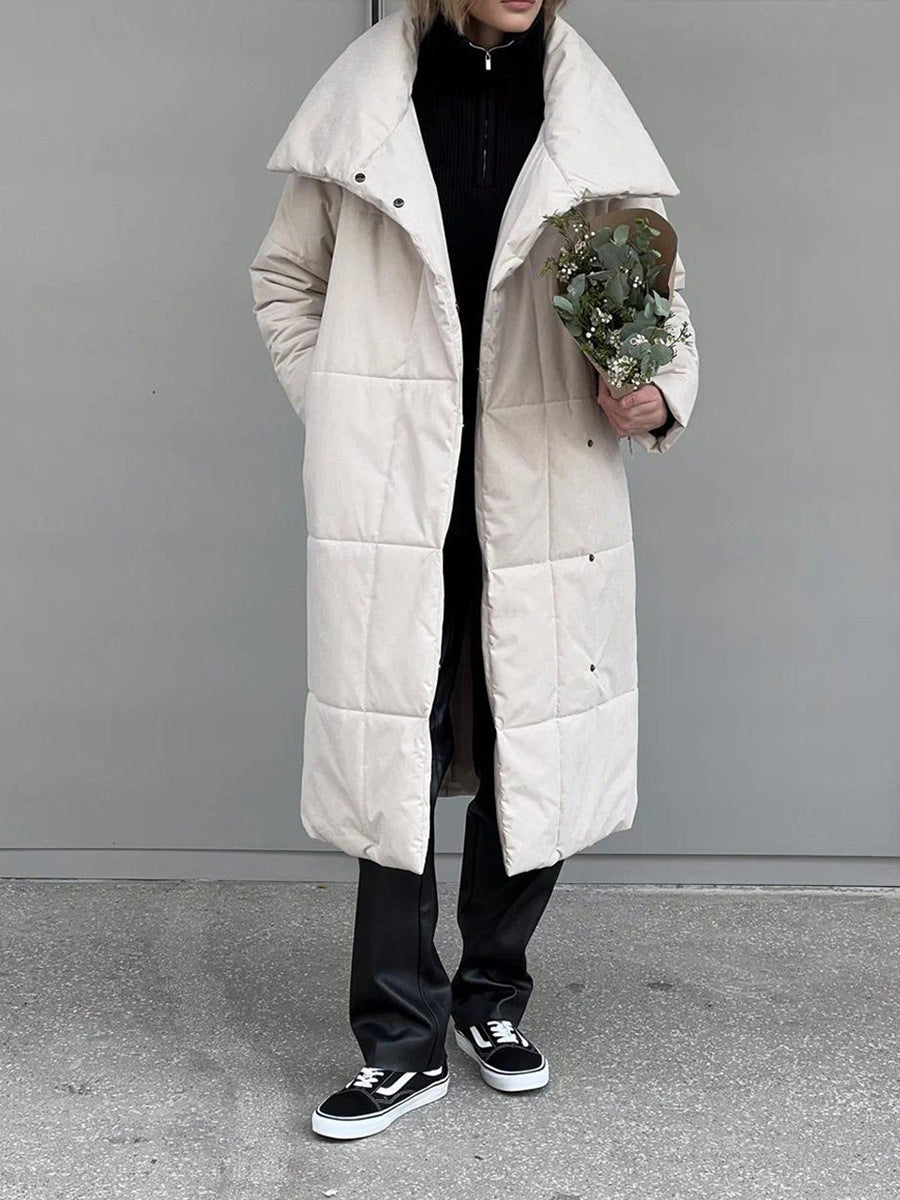 Woman in a long quilted coat with belt