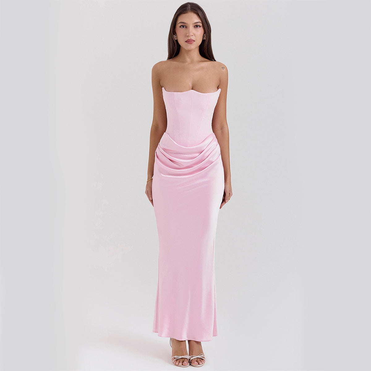 Woman in a strapless satin maxi dress