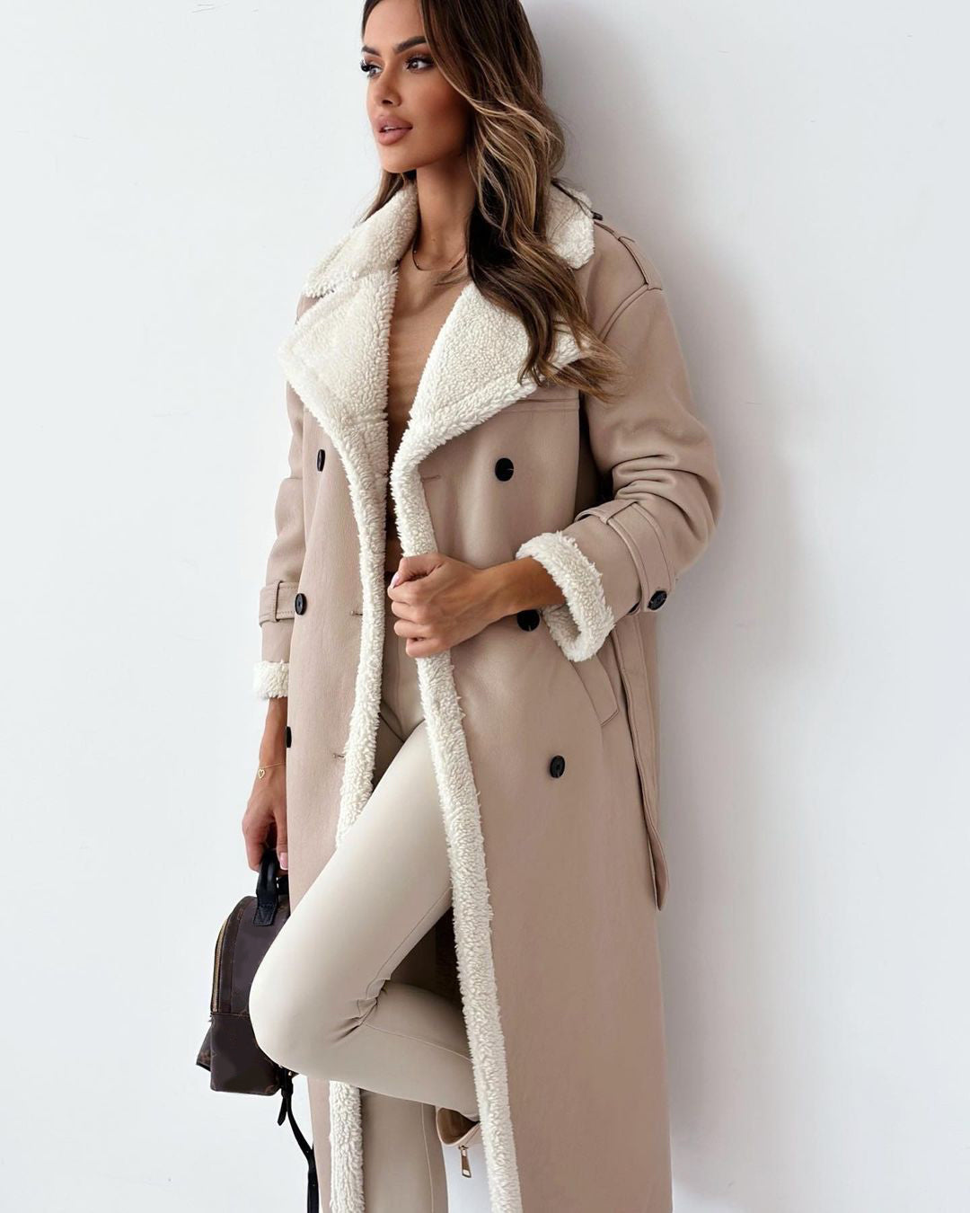 Woman in a long double-breasted belted coat