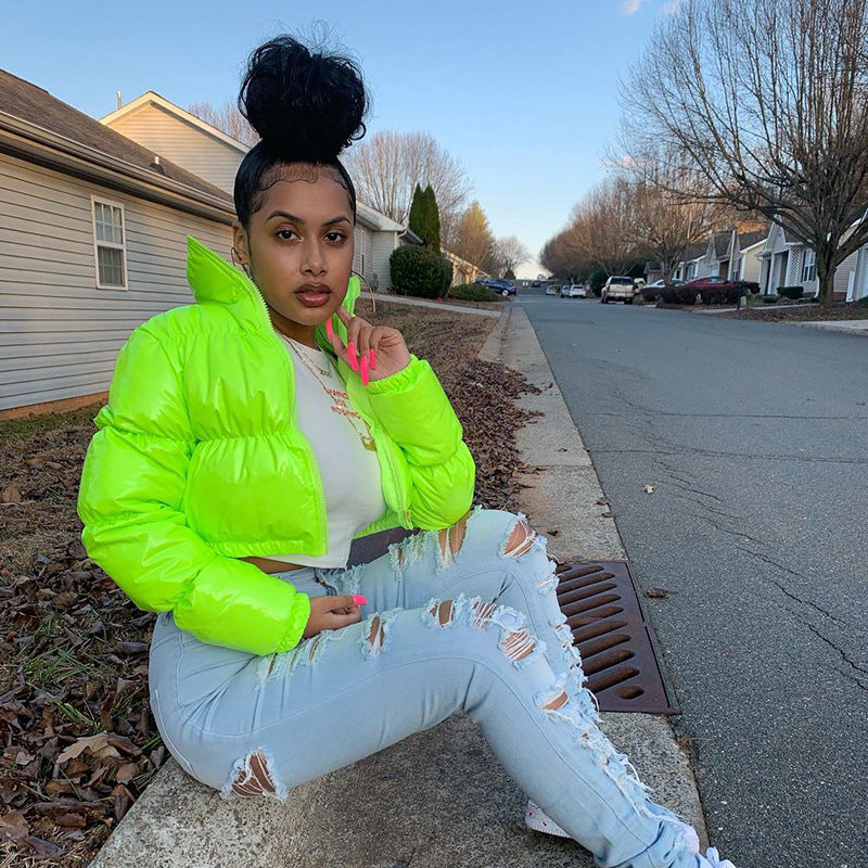 Woman in a glossy cropped puffer jacket