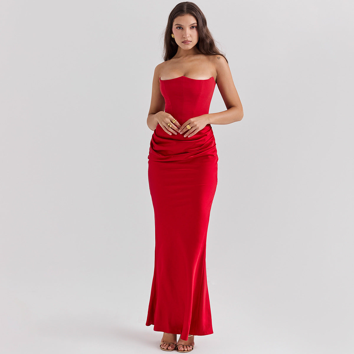 Woman in a strapless satin maxi dress