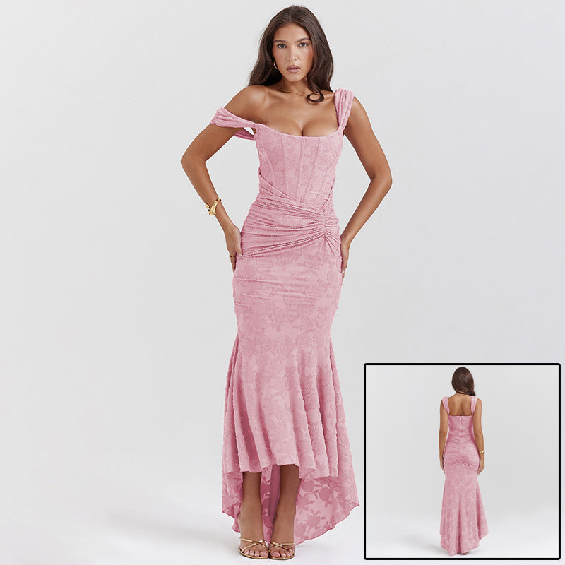Woman in an off-shoulder ruched maxi dress