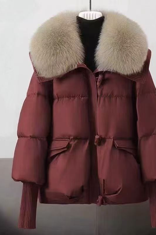 Woman in short puffer jacket with fur collar