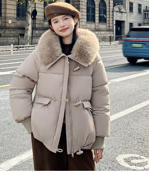 Woman in short puffer jacket with fur collar
